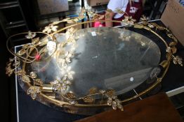 A modern mirror with ornate frame.