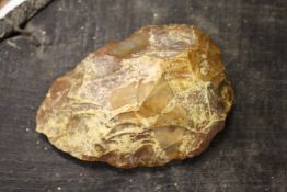 A flint hand axe, possibly prehistoric.