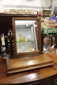 An oak dressing table mirror.