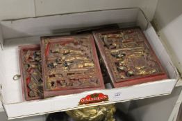 A set of four Chinese carved and gilded wood panels.
