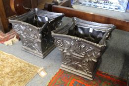 A good pair of painted cast iron jardinieres modelled as Corinthian column capitals.