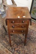 A 19th century mahogany three drawer drop flap work table.
