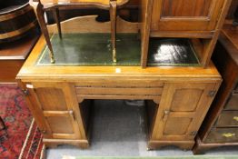 An oak pedestal desk.