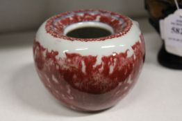 A small Chinese red glazed brush washer.