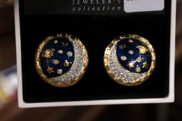 A cased pair of Swarovski decorative earrings.