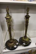 A pair of ornate table lamps.
