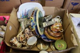 A box of decorative china.