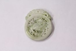 A small Chinese pierced roundel.
