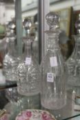 Two cut glass decanters.