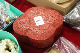 A Chinese moulded box and cover.