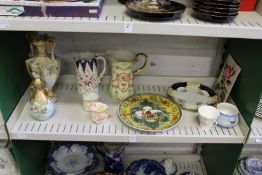 A shelf of decorative china.