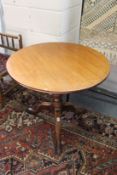 A 19th century mahogany circular tilt top tripod table.