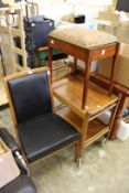 A tea trolley, a chair and a music seat.