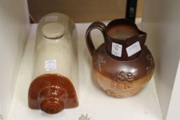 A Doulton salt glazed Harvest jug and a stoneware hot water bottle.