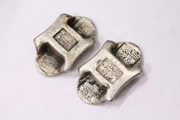 Two pieces of Chinese white metal money.