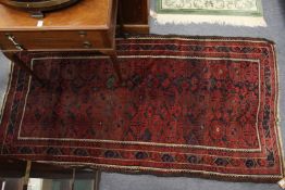 A blue ground Bokhara style Persian rug.
