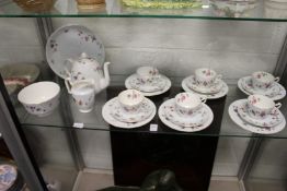 A Crown Staffordshire floral decorated tea service.
