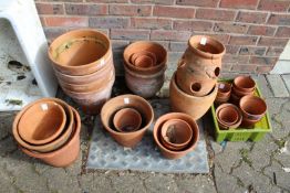 A quantity of terracotta plant pots.