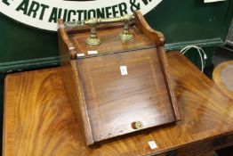 An Edwardian mahogany and brass coal box.