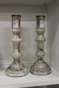 A pair of lustre glass candlesticks.