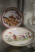 A Chinese Famille Rose circular dish depicting a figure on an elephant together with another dish (