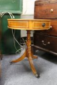 A yew wood small drum table.