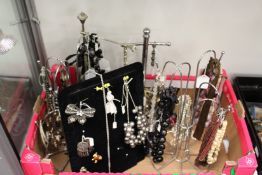 A quantity of bijouterie complete with necklace hangers etc.