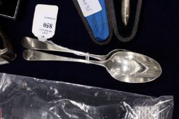 A pair of silver dessert spoons.