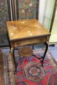 A good late Victorian inlaid rosewood envelope card table.