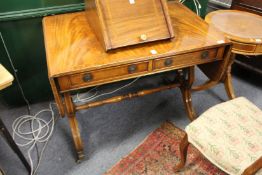 A reproduction mahogany sofa table made by E. G. Hudson of Worthing.