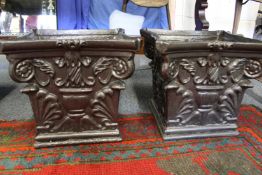 A good pair of painted cast iron jardinieres modelled as Corinthian column capitals.