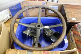 An early car steering wheel and three Lucas car horns.