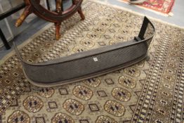 A pierced metal fender.