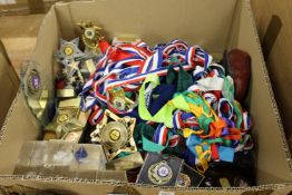 A large quantity of medals and trophies.