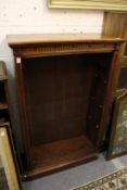 A Victorian walnut open bookcase.
