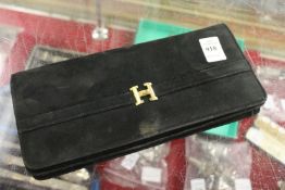 A ladies' velvet clutch bag.