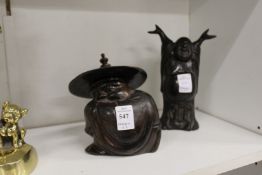 A Chinese bronze figure of a crouching man together with a bronze figure of Buddha.