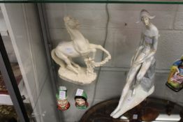 A large Nao figure of Harlequin together with a model of a horse and a pair of Beswick figural