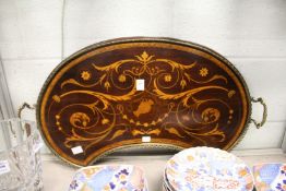 A good Edwardian inlaid mahogany kidney shaped tray with brass gallery and handles.