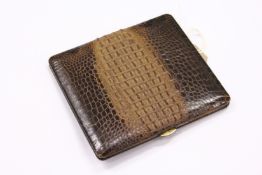 Harrods of London, a lizard skin cigarette case.