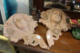 A pair of Art Nouveau style terracotta wall pockets.