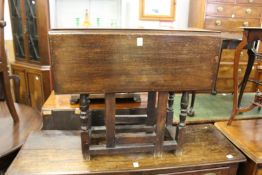A small oak drop leaf gate leg table.