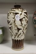 A Chinese Meiping shaped vase decorated with stylized bats.
