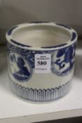 A small Chinese blue and white brush pot.