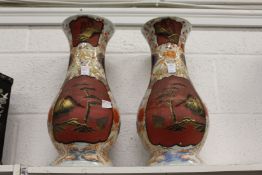 A pair of large Japanese vases with lacquer style panels.