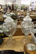 A good large pair of glass urns and covers.