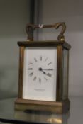 A brass carriage clock.