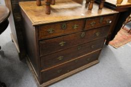 A George III oak chest of drawers.