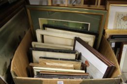 A box of paintings and prints.