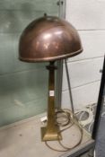 An Art Deco bronze lamp with copper shade.